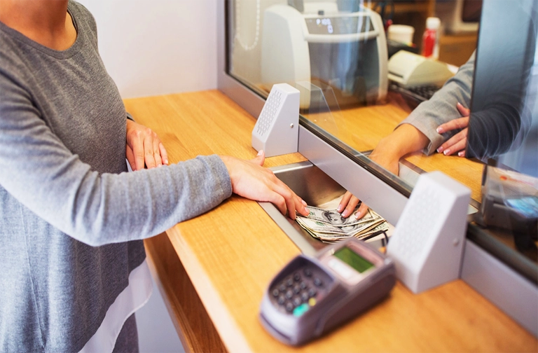 cash transaction through a teller window