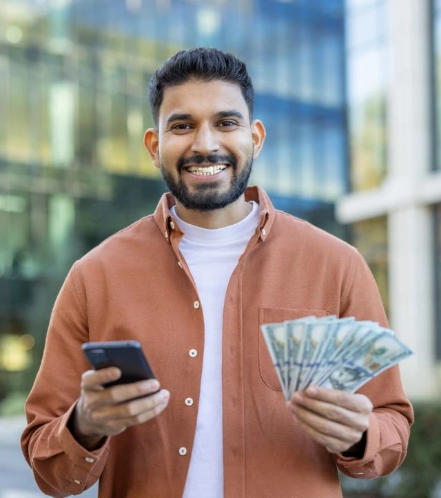 man with cash and a phone