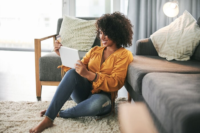 Woman reading her bank statement Woman reading her bank statement