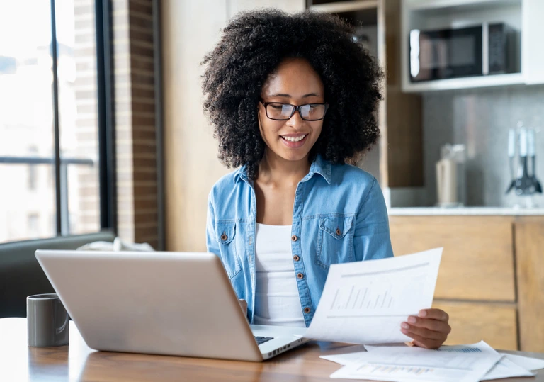 self-employed woman doing taxes self-employed woman doing taxes